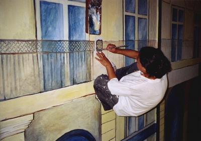 Sylvie Christophe préparant la mise en espace de l'exposition L'Ecole d'Alger, BFM, Limoges, 2003.
